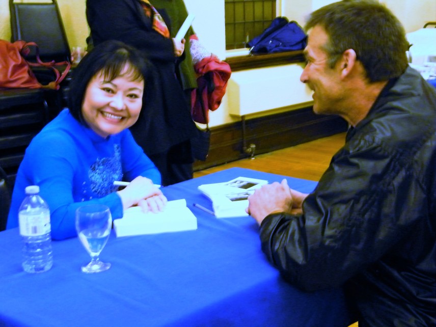 Sharing a laugh while Kim Phuc was signing my copy of her book.