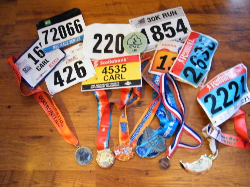 My 9 race bibs from 2015, 7 which had finishers medals.
